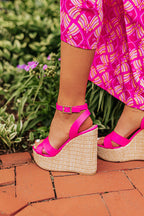 Hot pink faux leather wedge shoes featuring a 5 1/4 inch heel, combining modern style with a vibrant color. 2