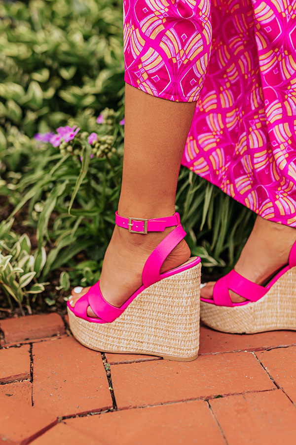 Hot pink faux leather wedge shoes featuring a 5 1/4 inch heel, combining modern style with a vibrant color. 2