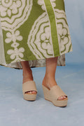 Tan jute wedge sandals with a wide woven strap and 4-inch heels, featuring a casual, bohemian style. 0