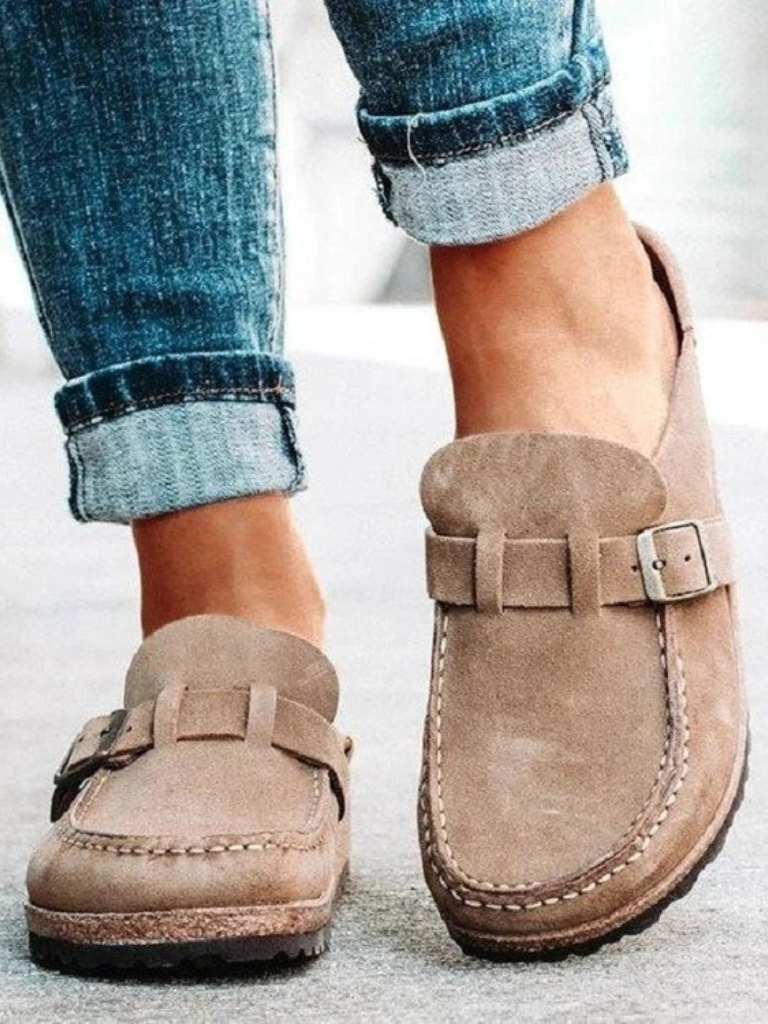 Brown suede clogs with a buckle and adjustable strap, featuring a comfortable and casual style. 5