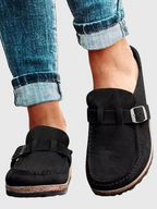 Brown suede clogs with a buckle and adjustable strap, featuring a comfortable and casual style. 7