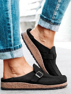 Brown suede clogs with a buckle and adjustable strap, featuring a comfortable and casual style. 8
