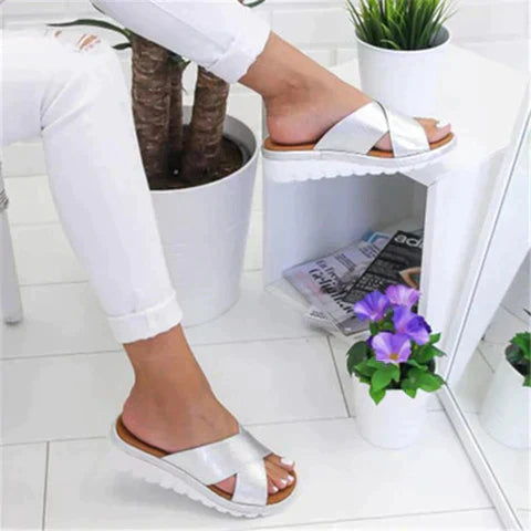 Light blue orthopedic sandals with a sleek, modern design and adjustable straps for comfort. 1