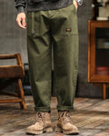 Relaxed fit vintage cargo pants in olive green cotton with flap pockets. 0