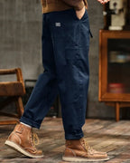 Relaxed fit vintage cargo pants in olive green cotton with flap pockets. 3