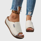 Light brown classic walking sandals with a cushioned sole, designed for comfort and casual wear. 1