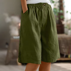Soft beige women's shorts in a relaxed fit, perfect for casual summer outings. 0
