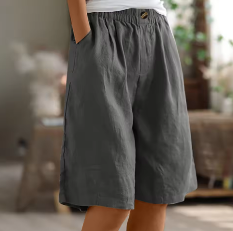 Soft beige women's shorts in a relaxed fit, perfect for casual summer outings. 1