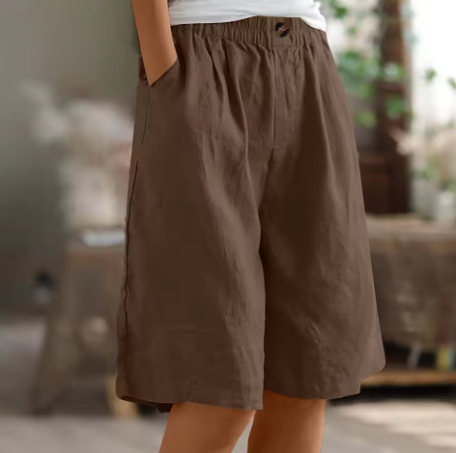 Soft beige women's shorts in a relaxed fit, perfect for casual summer outings. 11