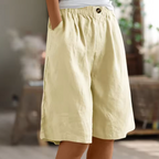Soft beige women's shorts in a relaxed fit, perfect for casual summer outings. 2