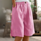 Soft beige women's shorts in a relaxed fit, perfect for casual summer outings. 4