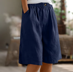 Soft beige women's shorts in a relaxed fit, perfect for casual summer outings. 5