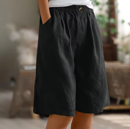 Soft beige women's shorts in a relaxed fit, perfect for casual summer outings. 9
