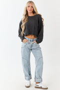 Light wash blue high-rise cuffed barrel baggy jeans with a relaxed fit. 0
