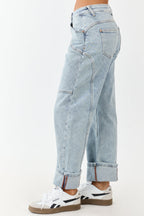 Light wash blue high-rise cuffed barrel baggy jeans with a relaxed fit. 2