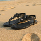 Beige bohemian flat sandals with an open vamp and colorful bead detail. 4
