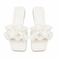 Vionnet vegan leather slides in soft beige with a minimalist design and open-toe style. 0