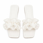 Vionnet vegan leather slides in soft beige with a minimalist design and open-toe style. 0