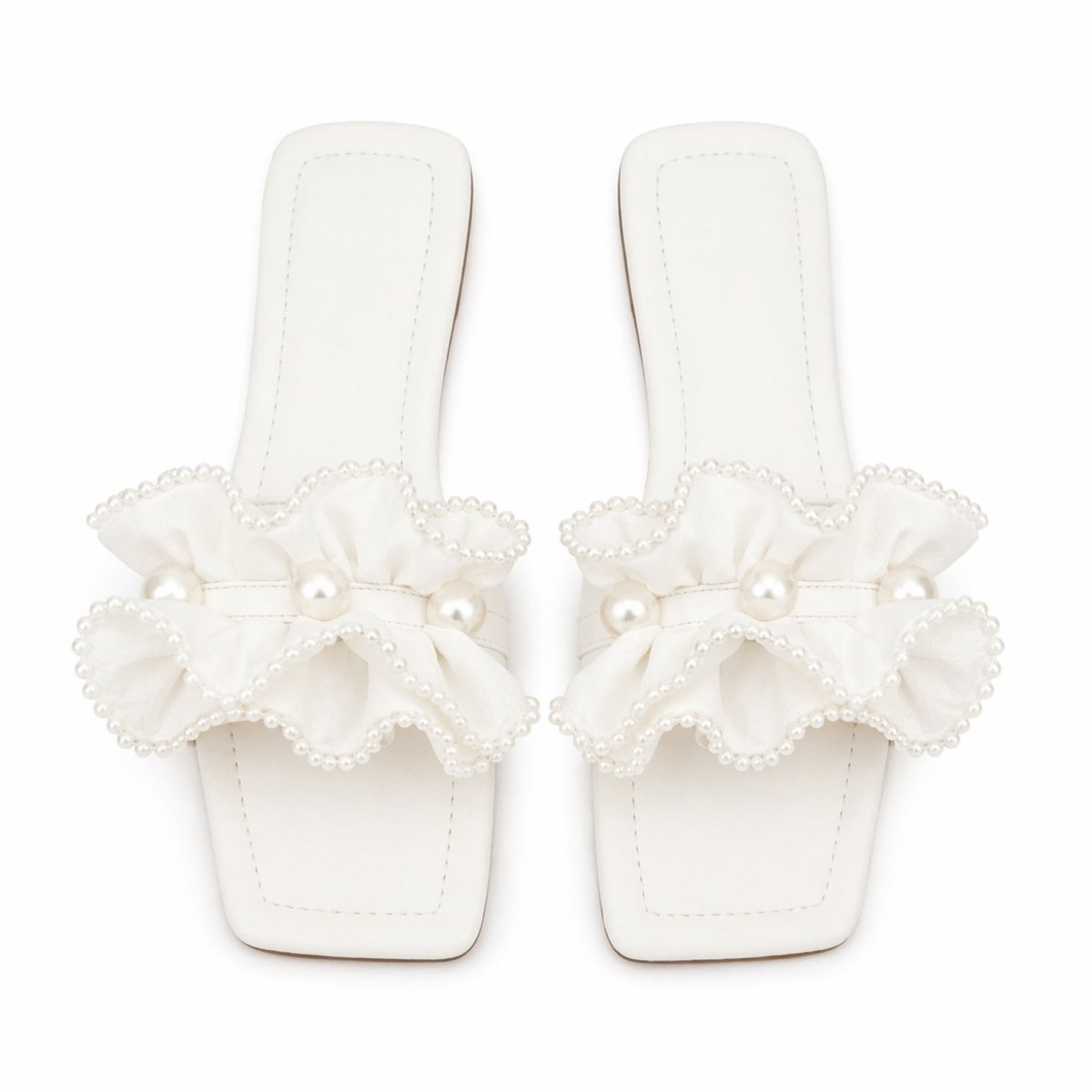 Vionnet vegan leather slides in soft beige with a minimalist design and open-toe style. 0