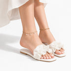 Vionnet vegan leather slides in soft beige with a minimalist design and open-toe style. 1