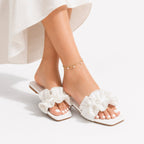 Vionnet vegan leather slides in soft beige with a minimalist design and open-toe style. 3