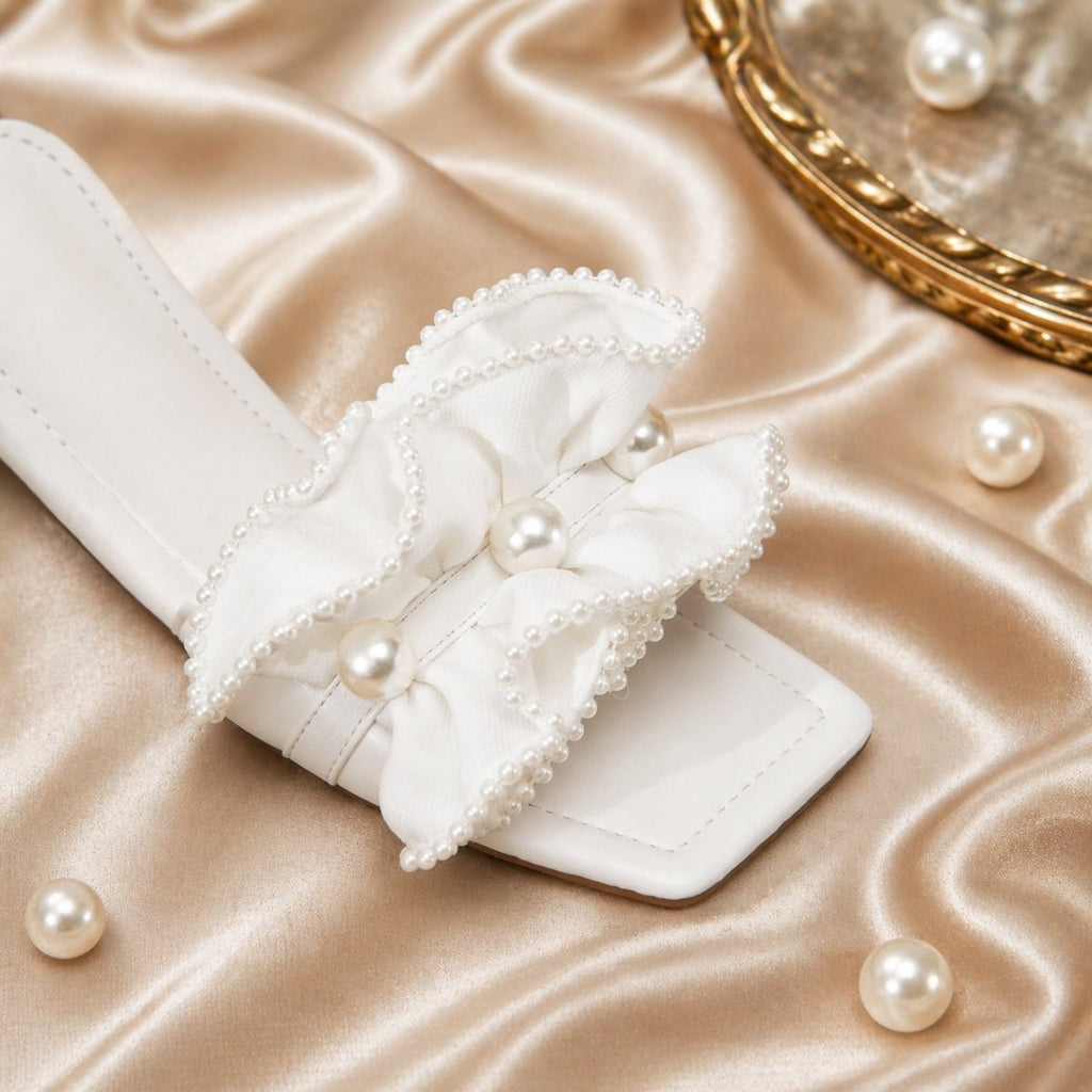 Vionnet vegan leather slides in soft beige with a minimalist design and open-toe style. 5