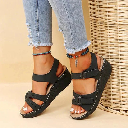 Lightweight brown walking sandals with a casual style, featuring adjustable straps for comfort. 1