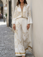 Bohemian-style blouse and wide-leg pants set in butterfly jacquard, featuring a soft cream color. 3
