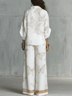 Bohemian-style blouse and wide-leg pants set in butterfly jacquard, featuring a soft cream color. 4