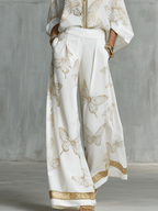 Bohemian-style blouse and wide-leg pants set in butterfly jacquard, featuring a soft cream color. 6