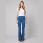 Kendra mid-wash denim flared pants with gold buttons, front