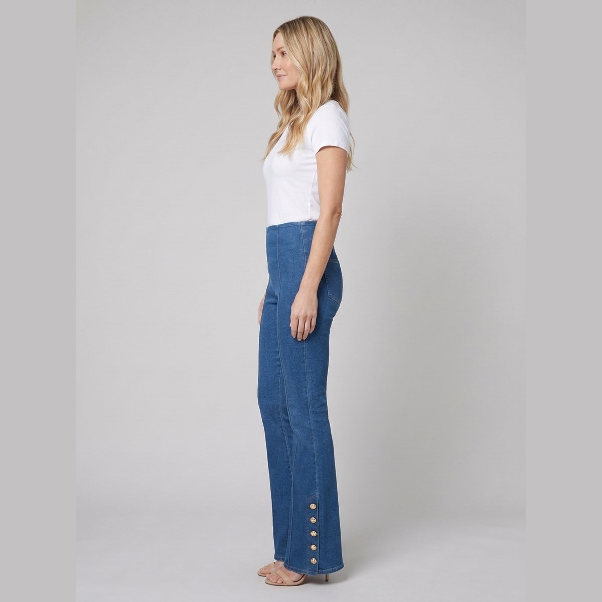 Kendra denim flared pants, side with gold button seam