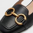 Celia slingback flat gold horsebit ornament close-up