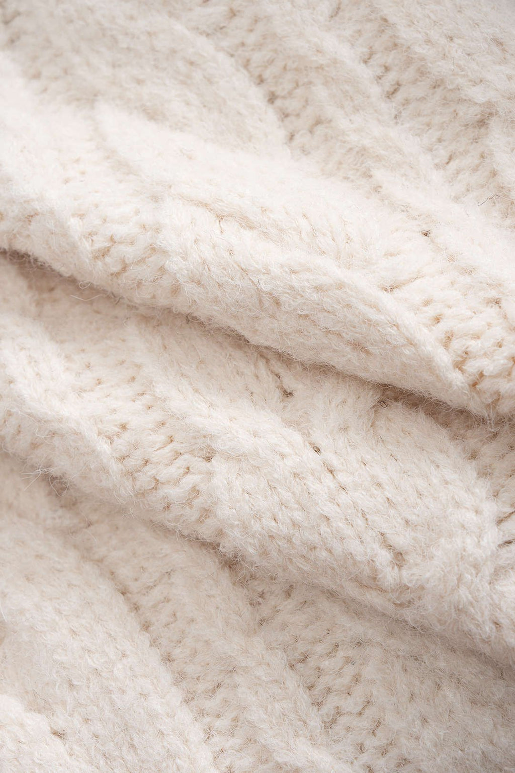 Floor cardigan cream cable-knit fabric close-up