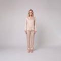Luxe satin pyjama set in champagne beige, front view on model