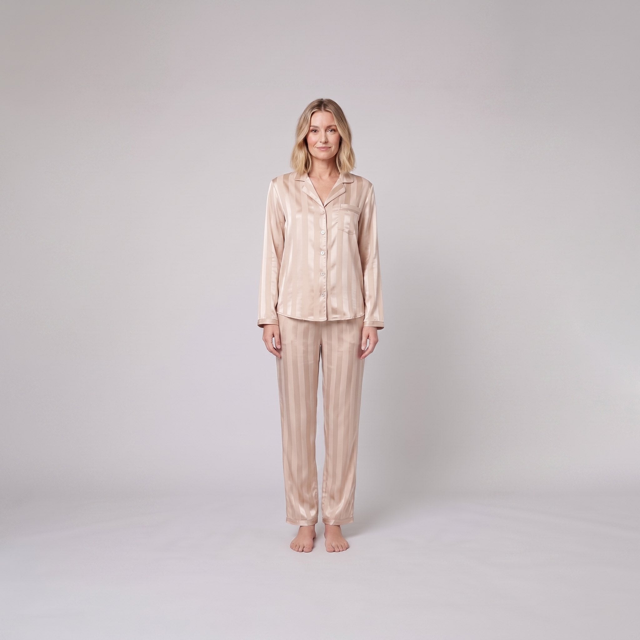 Luxe satin pyjama set in champagne beige, front view on model
