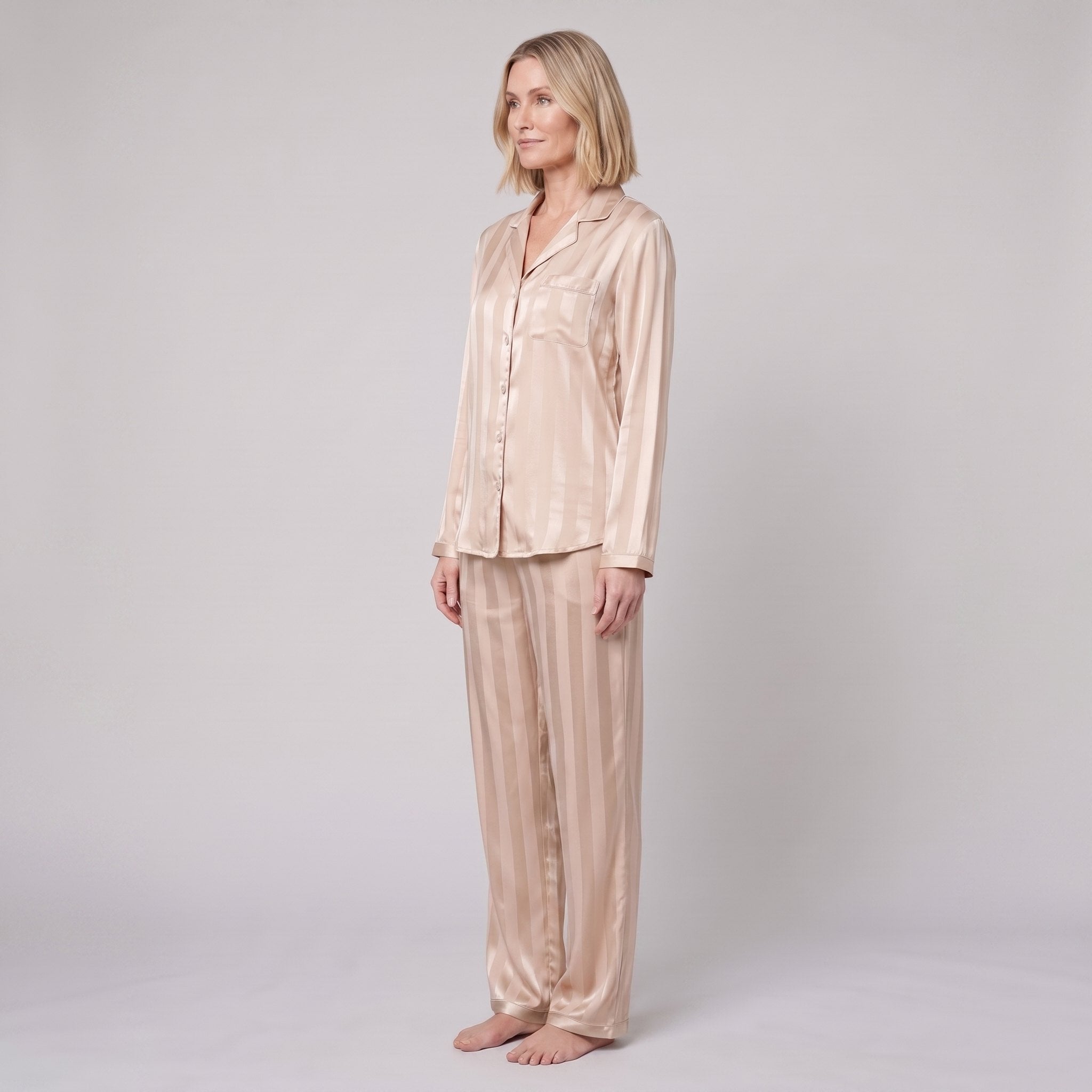 Luxe satin pyjama set in champagne beige, side view on model