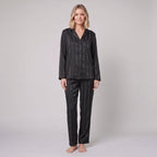Luxe satin pyjama set in black, front view on model