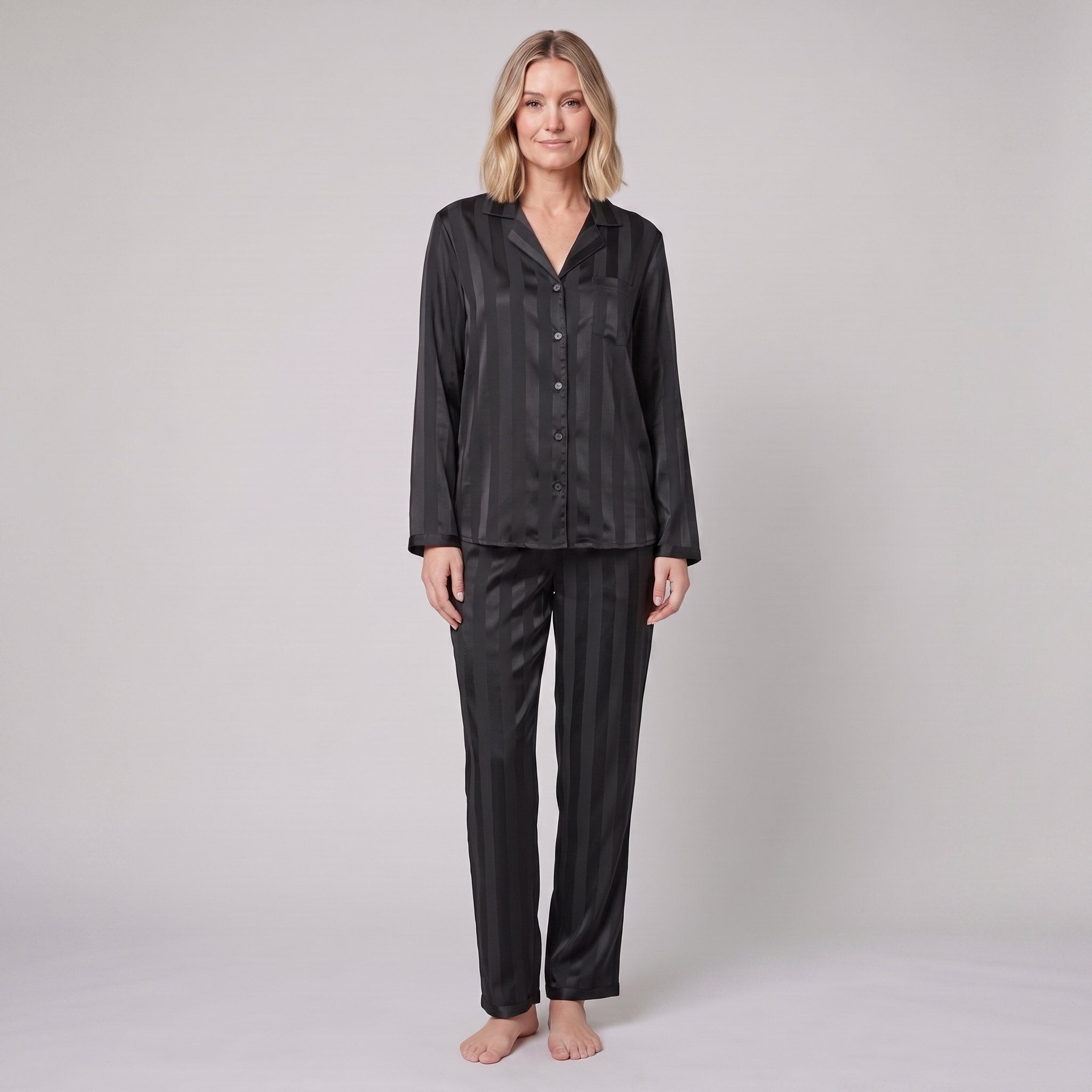Luxe satin pyjama set in black, front view on model
