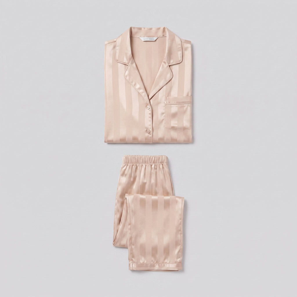 Luxe satin pyjama set in champagne beige, two-piece product flat-lay