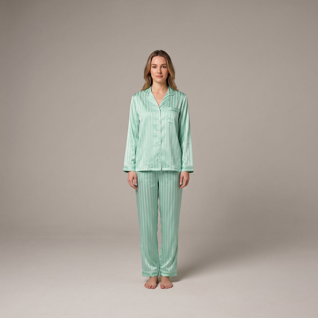 Luxe satin pyjama set in sage green, front view on model