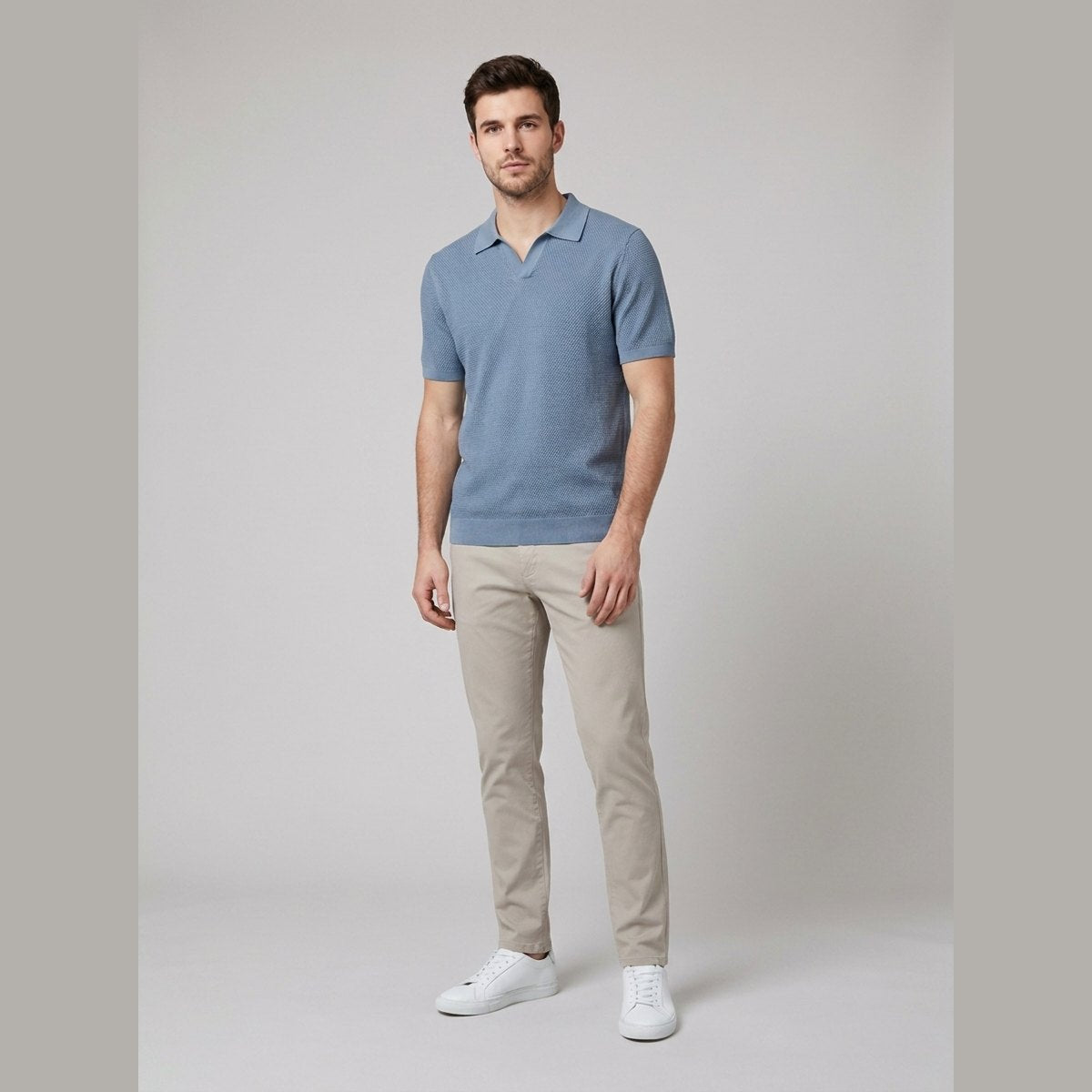Milo steel blue textured knit V-neck polo shirt on male model