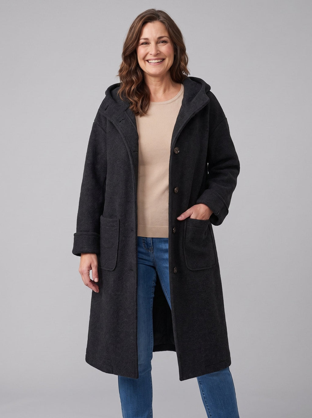 Nordin lightweight hooded wool coat in black worn open, front view on model