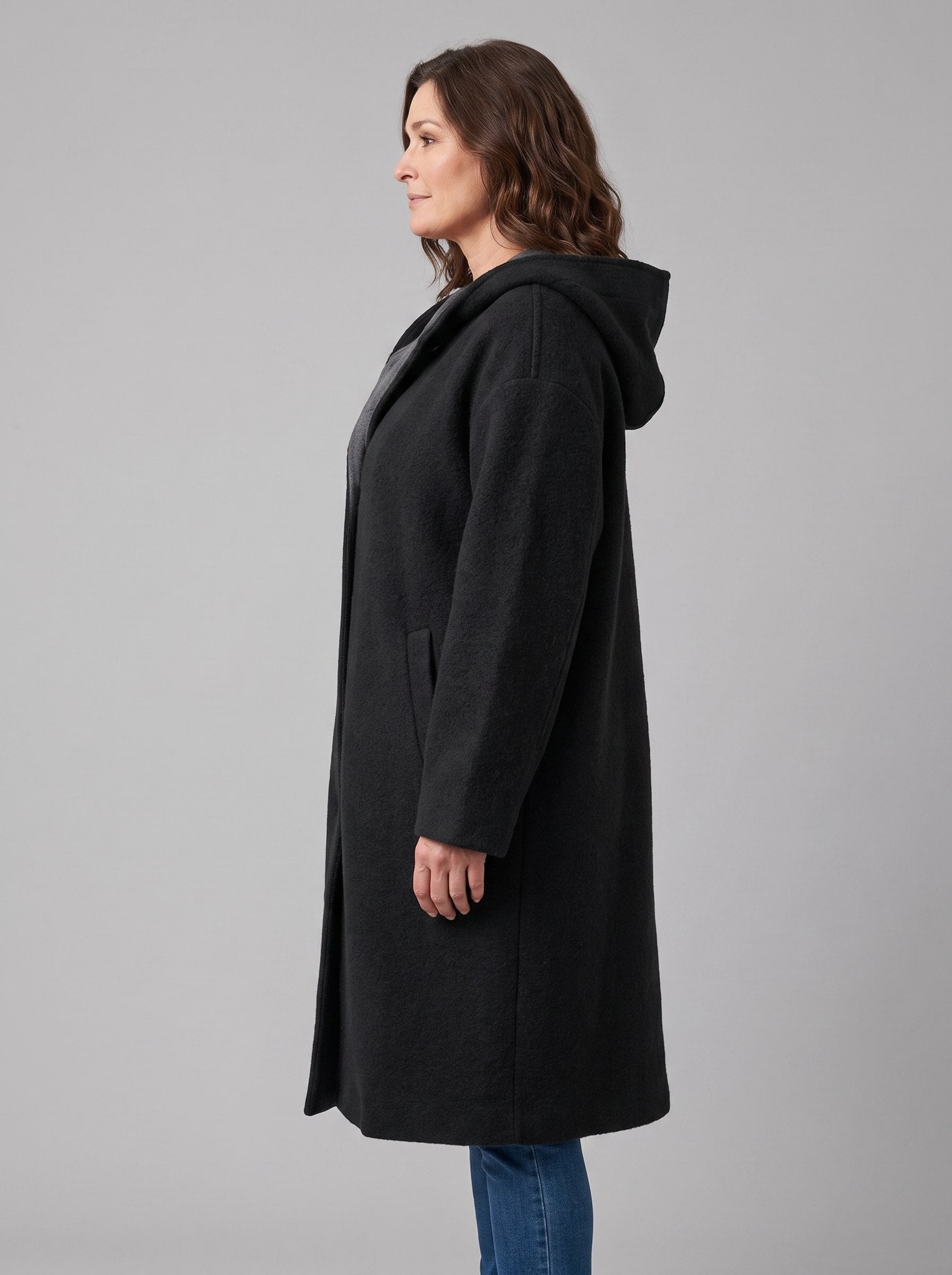 Nordin lightweight hooded wool coat in black, side view on model