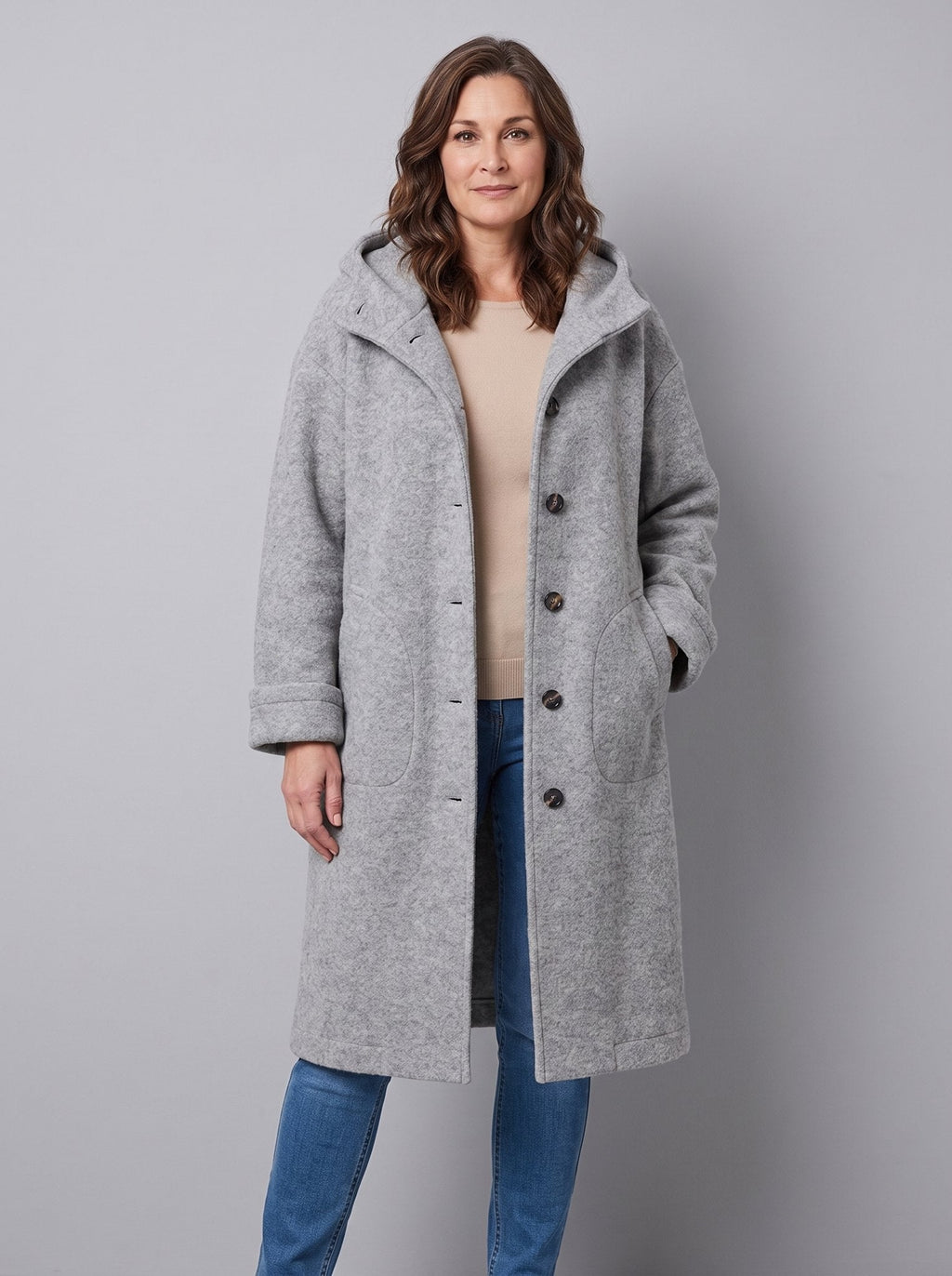 Nordin lightweight hooded wool coat in light heather grey, front view on model