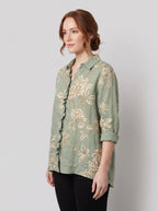 Rosalinde sage-green linen blouse side pose