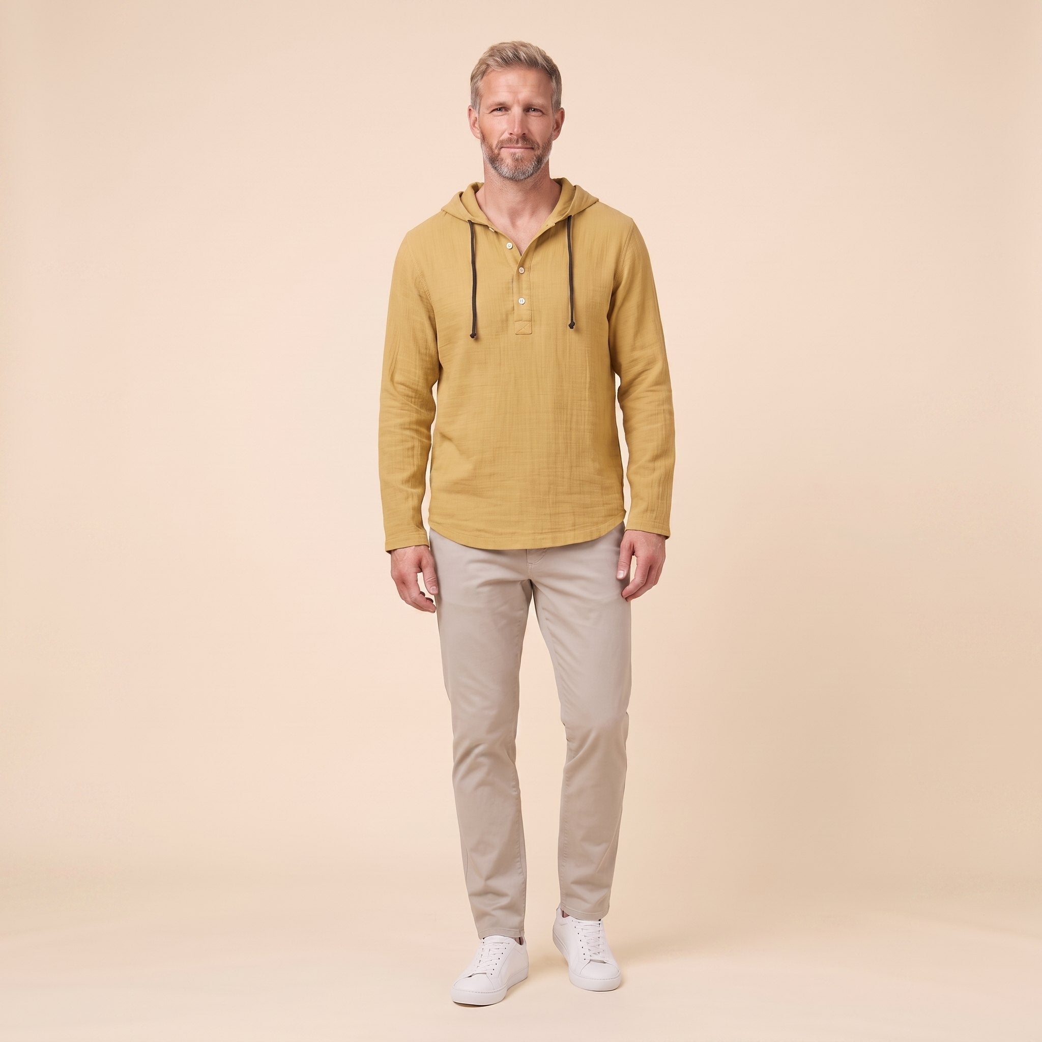 Seven linen hooded henley shirt in mustard, front view on model