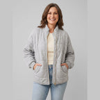 Timber oversized quilted jacket in grey on model