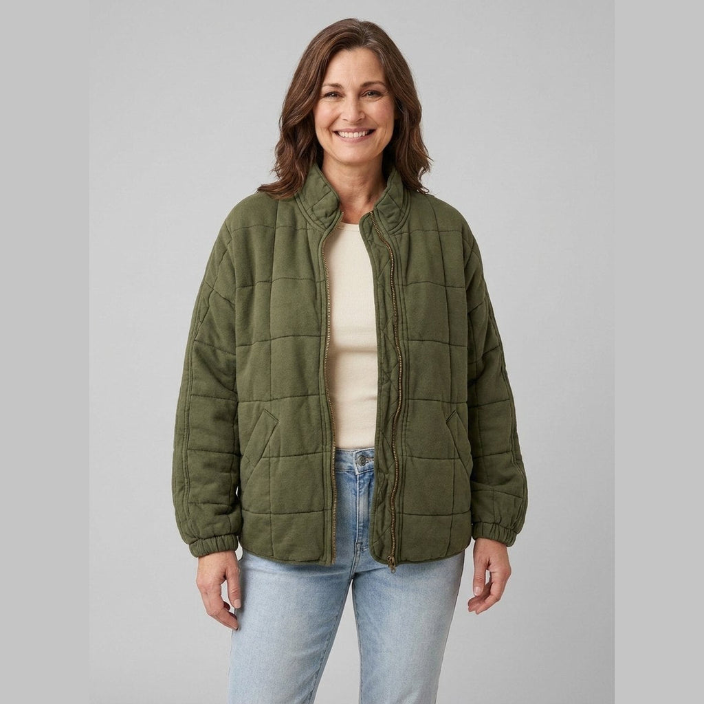 Timber oversized quilted jacket in khaki olive green on model