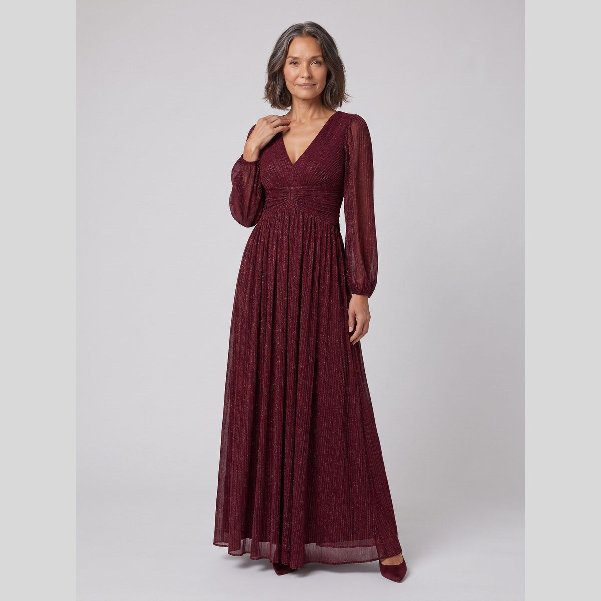Brym | Pleated Glitter Empire-Waist Gown by Vera Noir – in burgundy